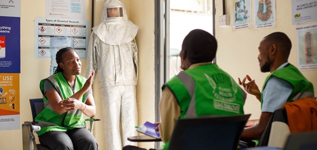 Photo of woman signing to a student